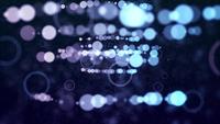 Soft rows of bokeh lights approaching and moving on dark background