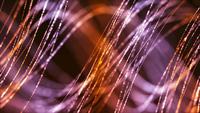 Gold and pink thin lines floating in the air like hair on dark background