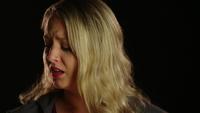 Woman crying and turning her face to the left