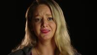 Woman crying and seeing to the camera