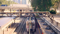 Aerial View Of Train Leaving The Station