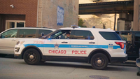 Chicago Officer In Police Van Parked On The Street