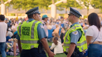Chicago Police Officers In Outdoor Auditorium In Millenium Park
