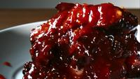 BBQ sauce pouring and splashing in ultra slow motion (1,500 fps) onto BBQ ribs - BBQ PHANTOM 077