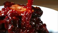 BBQ sauce pouring and splashing in ultra slow motion (1,500 fps) onto BBQ ribs - BBQ PHANTOM 078