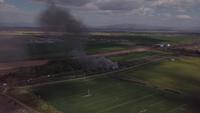 Drone flying towards a fire in 4K