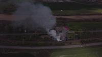 Drone flying towards a fire in 4K