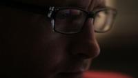 attractive young man using smart phone chat typing browsing reflection eye glasses close up hipster touchscreen modern lifestyle connected online concept happy new technology shopping looking