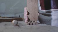 a carpenter joins two wooden parts made using the technology of a dovetail with a hammer. Detail of a carpenter with dovetail joints. 4k. 4k video. slow motion. 24 fps