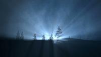 Luz atrás de uma colina à noite