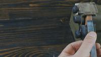 Man sharpens tool
