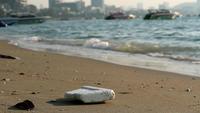 Beach with plastic rubber and waste 