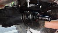 Repairing the drive shaft of the truck.