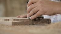 Woodworker Works with A Manual Electric Milling Cutter